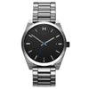 MVMT Element Ion Silver Men's watch: minimalist silver, black face, Japanese quartz movement, date window at 3 o'clock.