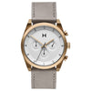 MVMT Element Chrono Bronze Ore men's watch: gold-framed, gray band, white face, Japanese quartz for precise timekeeping.