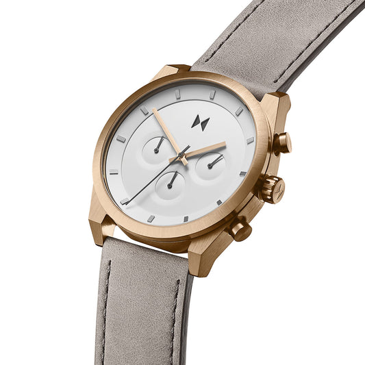 The MVMT Element Chrono Bronze Ore watch features a gold case, white face, grey leather strap, and Japanese Quartz Movement.