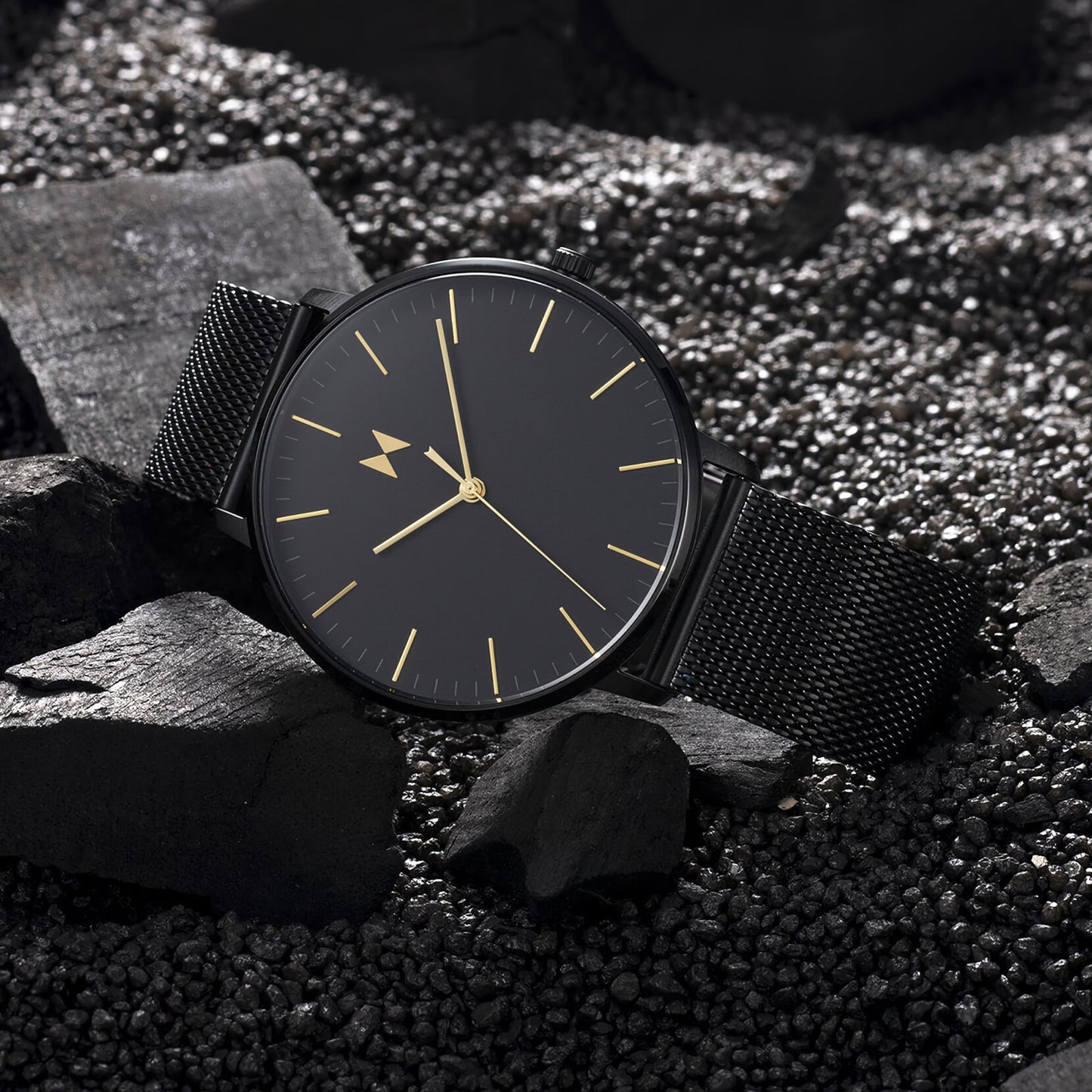 MVMT Legacy Slim Viper Black Men's watch, minimalist with gold markers and Japanese quartz on textured stones.