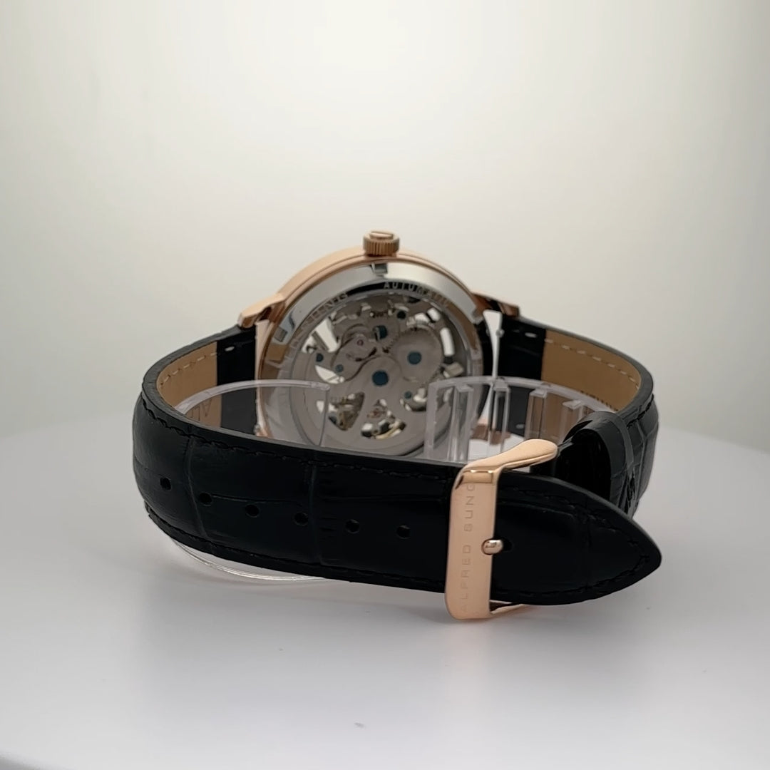The Alfred Sung Automatic III men's watch features a black skeleton dial and a black leather strap.