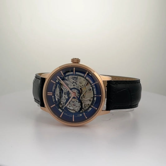 Alfred Sung Automatic III men's watch with black skeleton dial and black leather strap on white surface.