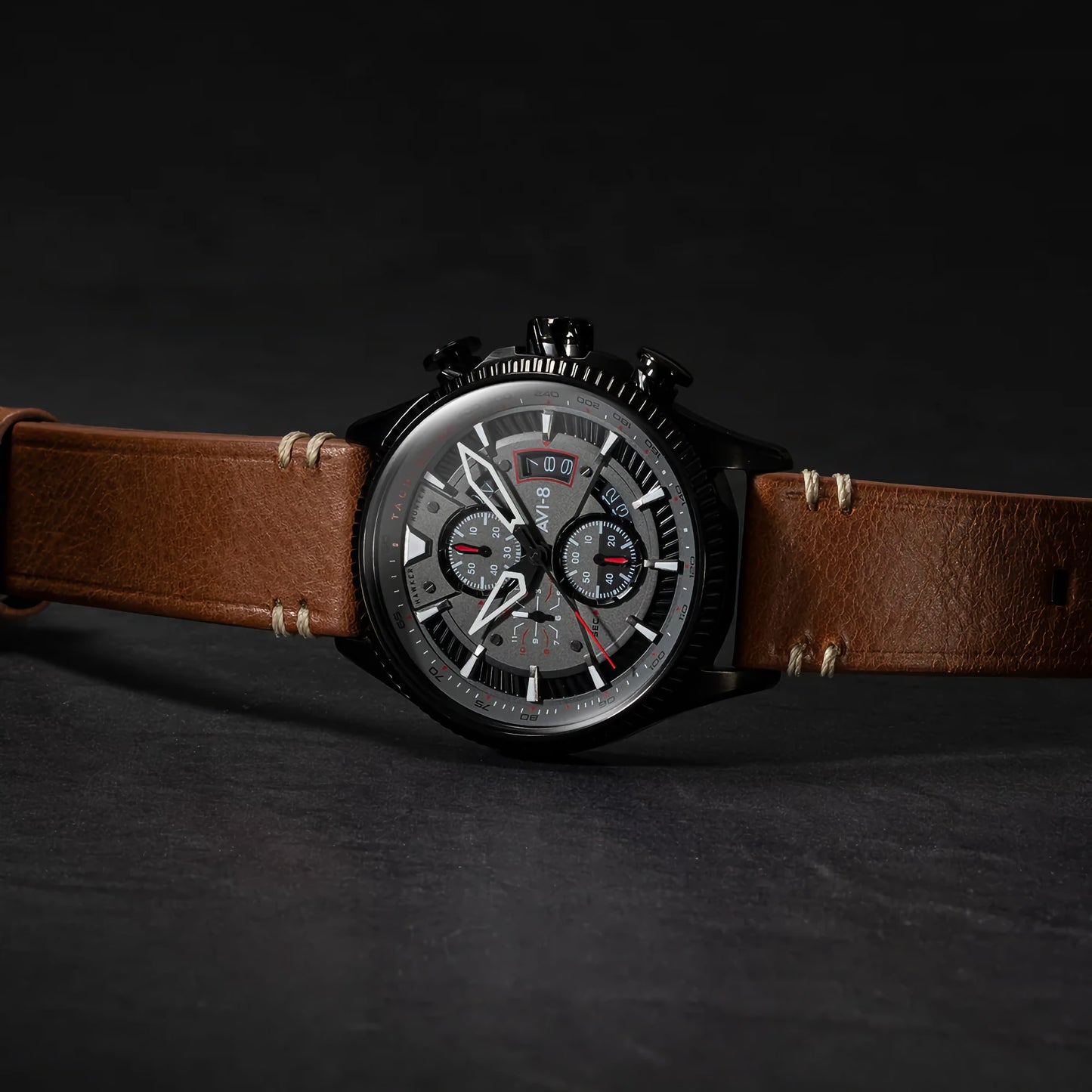 AVI-8's Hawker Hunter Avon Chronograph watch boasts a brown leather strap and intricate scarlet black dial.