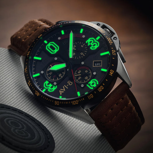 Close-up of the AVI-8 P-51 Mustang Blakeslee Chronograph with luminescent numerals, leather strap, and a WWII aviation-style dial.