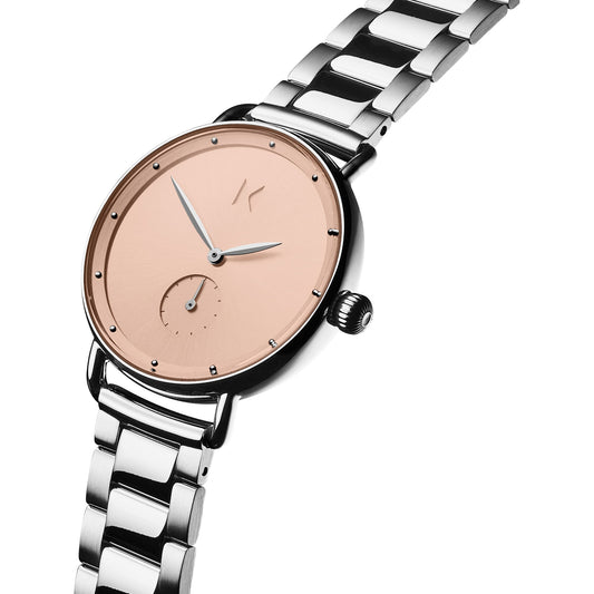 MVMT Bloom Blush Dhalia: Silver watch, rose gold face, Japanese quartz movement, minimal design, metal link band.