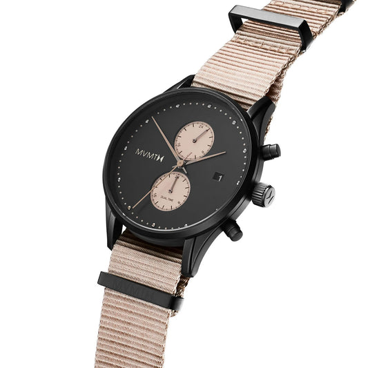 The MVMT Voyager Desert Men's watch features a black face, dual dials, beige strap, and 10 ATM water resistance.