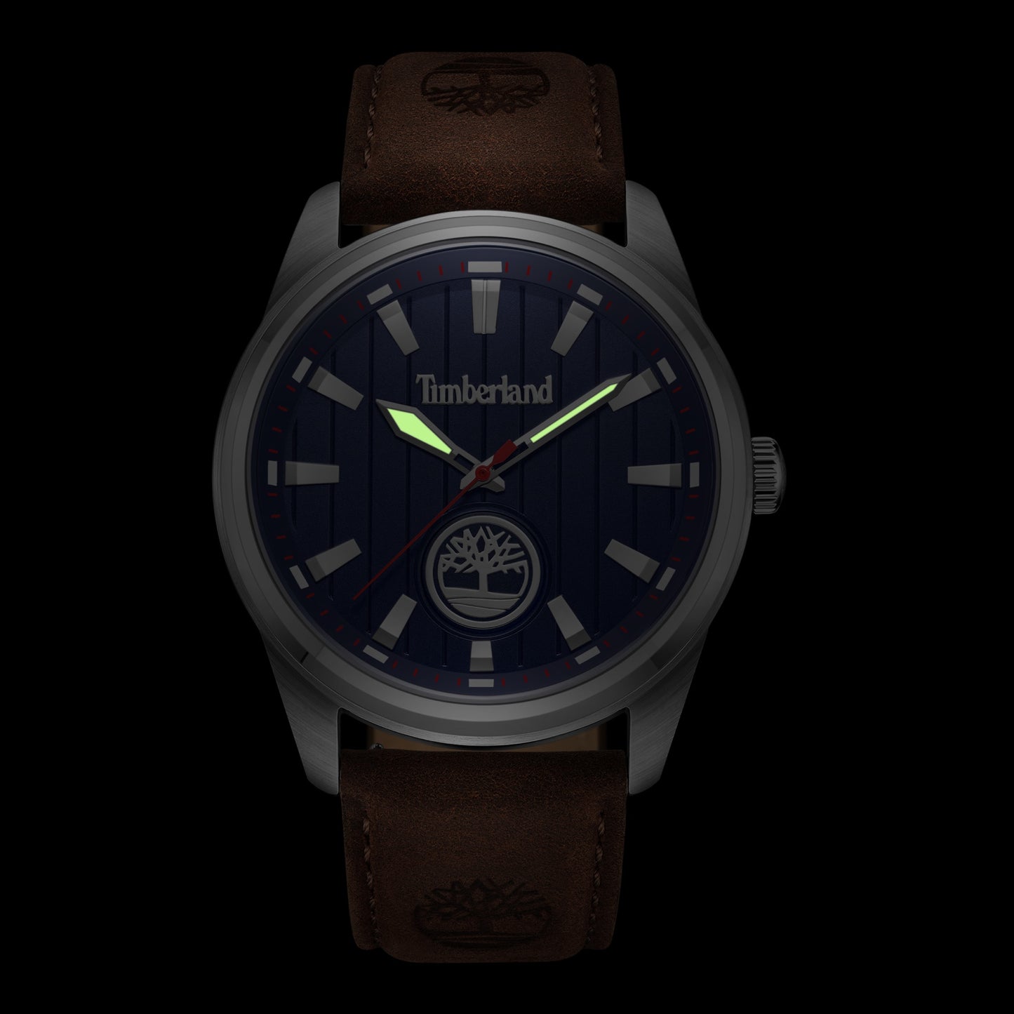 Timberland Northbridge watch with dark face, glowing hands, logo, and genuine leather strap on a black background.