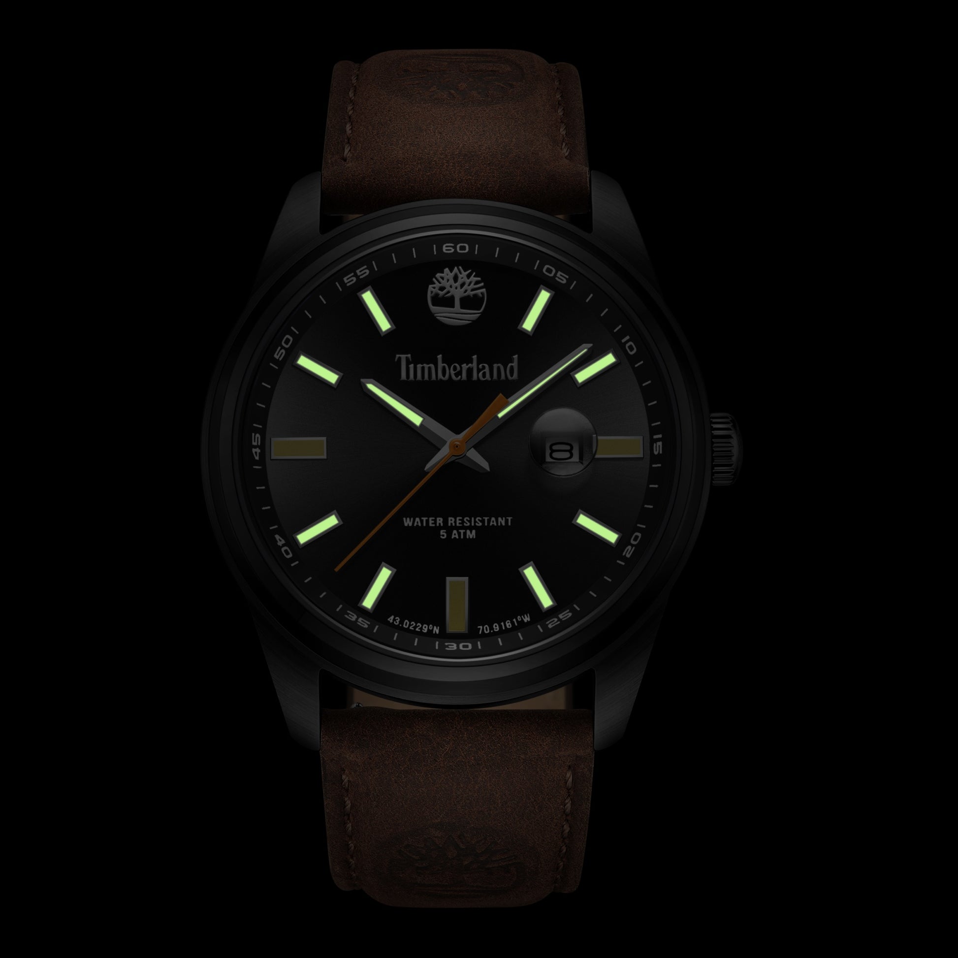Timberland Orford watch, Japanese quartz, brown leather strap, glowing markers on black face.