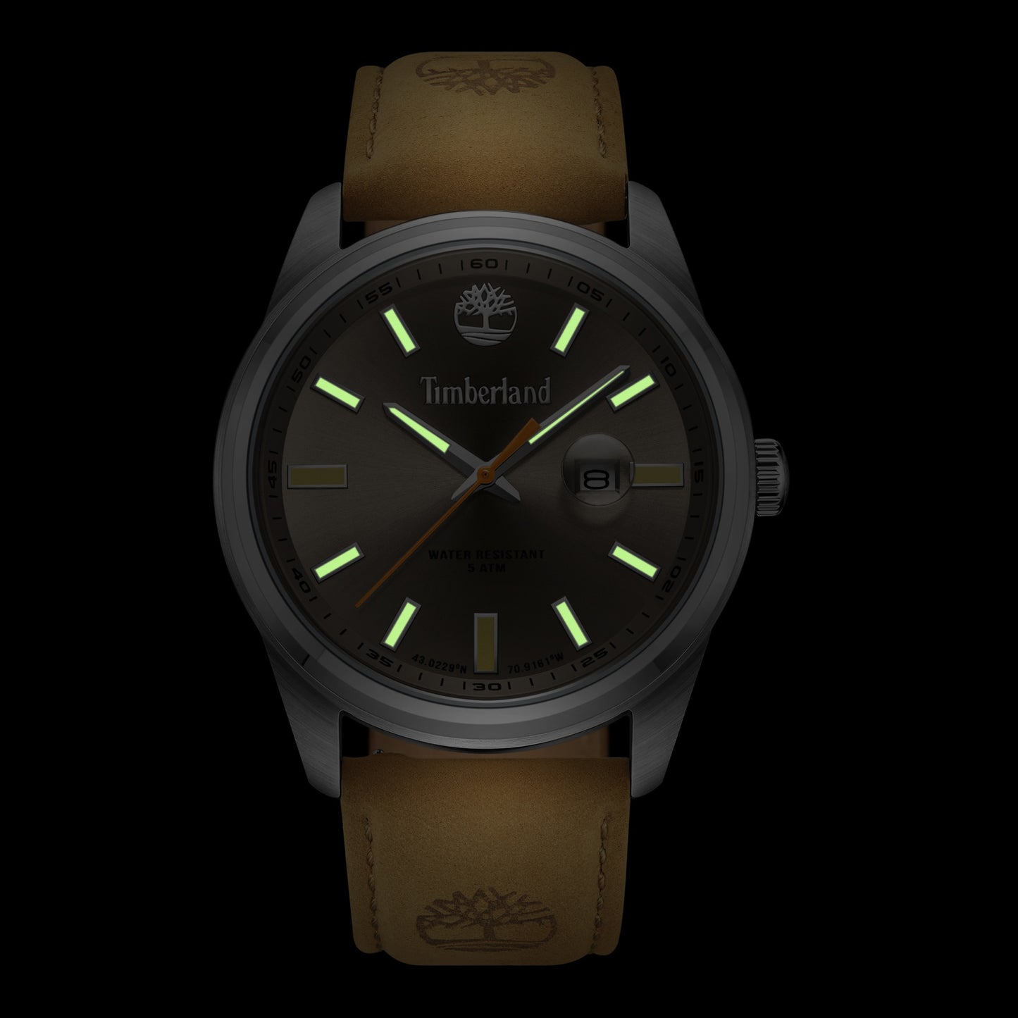 The Timberland Orford Men's watch features a brown leather strap and glowing green markers on a dark background.
