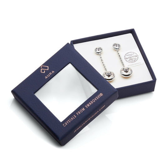 Stunning Drop and Dangle Earrings With Crystals presented in an Aura branded blue box with a transparent lid, showcasing elegant 18k gold accents.