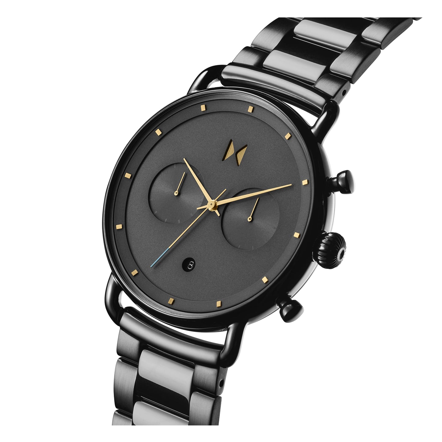 The MVMT Blacktop Honey Smoke Grey Dial watch for men features a sleek metallic band with gold hands and markers. It includes two subdials and is powered by the reliable Miyota 6S21 movement.