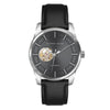 Alfred Sung Automatic men's watch with black leather strap, silver case, and exposed gears on dark face.