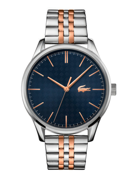 Enhance your style with the refinement and elegance of a Lacoste Men's Vienna Watch 2011048. This men's watch features a captivating blue dial complemented by a lustrous rose gold tone.
